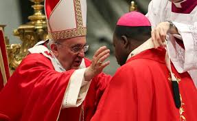 Pope Francis investing an Archbishop with the pallium